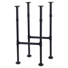 three black metal candlesticks are standing next to each other on the same pole