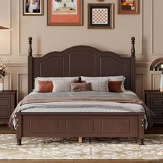 a bedroom with a bed, dressers and pictures on the wall above it's headboard