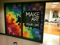 an office lobby with colorful art on the wall and large windows that say make smart choices in your life