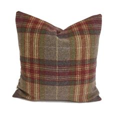 a brown plaid pillow on a white background with a red and green checkered pattern