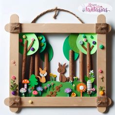 a wooden frame with an animal and forest scene