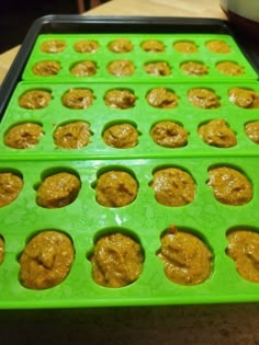 there are many cookies in the tray on the table and ready to be baked into muffin tins