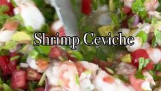 shrimp ceviche with red peppers, onions and lettuce in a bowl