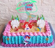 a birthday cake with ariel the mermaid on it