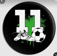 a soccer ball and shoes with the letter h in green spray paint on a black background