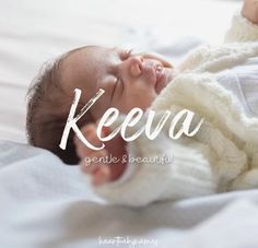 a baby laying on top of a bed with the words keeva written above it