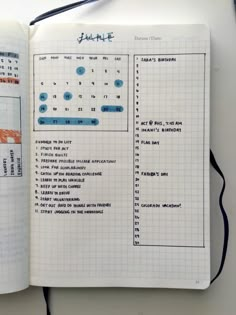 an open planner book sitting on top of a table