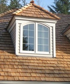 a brown roof with a white window on it