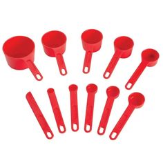 red plastic measuring cups and spoons are arranged in a circle on a white background