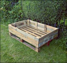 a wooden crate sitting in the grass