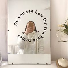 a woman taking a selfie in front of a mirror with the words do you see how far she is?