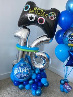 balloons and heliums are arranged in the shape of numbers