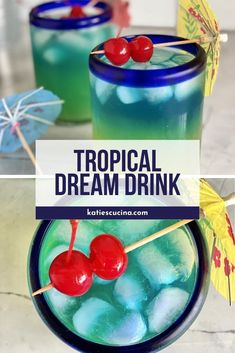 two glasses filled with blue liquid and cherries on the rim, next to an umbrella that says tropical dream drink