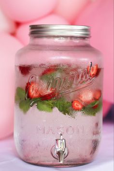 a mason jar filled with water and flowers