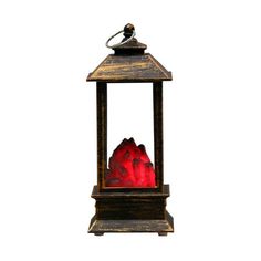 a red rock in a wooden lantern on a white background