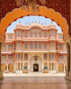 an archway leading into a building with ornate architecture