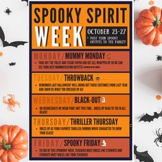 the spooky spirit week poster is displayed on a table with pumpkins and spider web