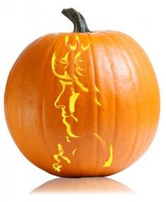 an orange pumpkin with the face of a woman painted on it's front and side