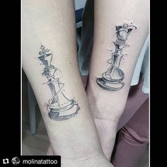 two people with matching tattoos on their arms, one has a chess piece and the other has