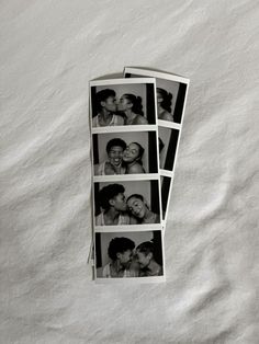 four pictures of people kissing each other on a sheet of white paper with black and white photos