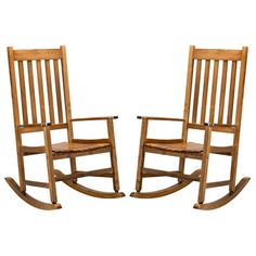 two wooden rocking chairs sitting next to each other