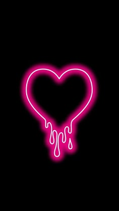 a neon heart with dripping liquid on it