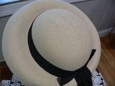 Really great 1940's Panama hat. It is a nice creamy beige with a pale yellow hue. Not white. It has a round crown with a deep u at the bottom between crown and brim. The brim is turned down all around. I do not know if this is the supposed shape but this was kept in a hat box since it was bought. I would like the front brim to be flat and turned down like a fedora. Not sure it that could be done I personally not attempt it although I have seen UTube videos on this. The hat looks good as is on fo Custom Made Hats, Maid Of Honour Dresses, Lace Nightgown, Feather Headband, Slouch Hat, Hat Box, Ostrich Feathers, Beautiful Hats, Pale Yellow