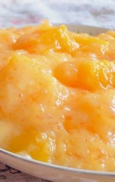 a close up of a bowl of food on a table with a cloth and napkin