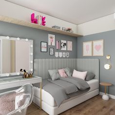 a bedroom with a bed, desk and mirror on the wall next to it is decorated in pastel colors