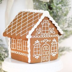 a gingerbread house is decorated with icing