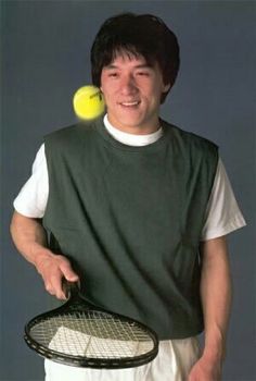 a man holding a tennis racket and ball