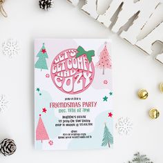 a pink and green christmas party card next to other holiday decorations