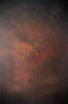 an orange and brown background with some black spots on it's surface, as well as the colors in the sky