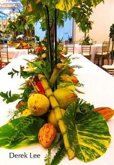 the table is set up with many different types of fruits and vegetables on top of it