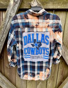 This is a one of a kind Dallas Cowboy plaid flannel shirt.  This size medium flannel shirt has two pockets on the front, buttons up and is long sleeve. On the back of the shirt is a DALLAS COWBOYS tee that has been sewn into the back of the shirt. The flannel is frayed around the tee as well as around the bottom of the flannel. This shirt has been bleached which gives it an overall distressed vintage style look.  All my shirts are ONE OF A KIND. They are all upcycled by being previously owned so there will be signs of wear and tear. This is what make each shirt unique in its own way and for sure makes them the most comfortable.  *NOTE: All my flannels are mens unless otherwise stated above. Here are some popular ways to wear these shirts. Upcycled/Bleached/Distressed Long Sleeve Size  Medi Diy Flannel Shirt Refashion, Flannel Shirt Ideas, Upcycle Flannel Shirt, Flannel Upcycle, Tshirt Hacks, Reworked Clothes, Distressed Long Sleeve, Bleached Flannel Shirt