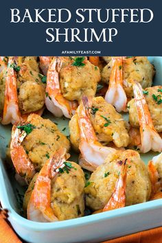 baked stuffed shrimp in a blue dish with parsley on top and text overlay