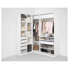 an open closet with clothes and shoes in it