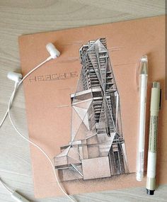 a drawing of a tower with headphones on top of it next to a pair of earbuds