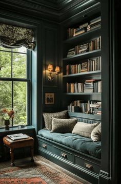 a room filled with lots of books on top of a book shelf next to a window