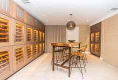 a wine cellar with stools and tables in it