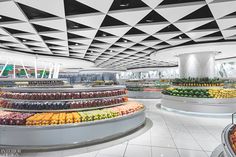 the interior of a grocery store filled with lots of fruits and vegtables