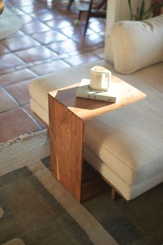 a couch with a wooden table on top of it