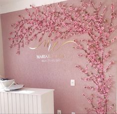 a pink wall with flowers on it