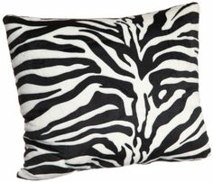 a black and white zebra print pillow on a white background