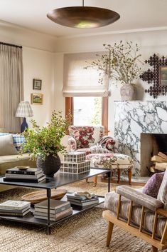 a living room filled with furniture and a fire place