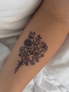 Fine line flower bouquet tattoo Flower Bouquet With Word Stem Tattoo, Wrapped Flower Bouquet Tattoo, Bouquet With Bow Tattoo, Flower Bouquet With Bow Tattoo, Flower Bouquet On Ribs Tattoo, Fine Line Flower Bouquet Tattoo Arm, Fine Line Flower Bouquet, Line Flower Bouquet, Fine Line Flower Bouquet Tattoo