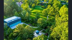 an aerial view of a house surrounded by trees