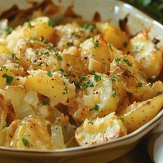 potatoes with parmesan cheese and herbs in a bowl