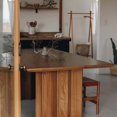 a wooden table sitting in the middle of a room