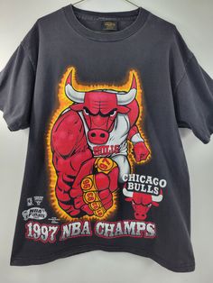 "1997 Bulls Ring Finger Tee Single stitch sleeves. Changes Tag Pit to pit: 22\" Top to bottom: 28\" This is an actual vintage (used) item and can show signs of wear. Please inspect all pics to insure you are satisfied with condition before buying.   Happy to answer any questions. IG: @hulapopper.vintage" Cheap 90s Sports T-shirt, Chigago Bulls, 90s Culture, Bulls T Shirt, Basketball Vintage, Nba T Shirts, Vintage Nba, Streetwear 90s, 90s Hip Hop